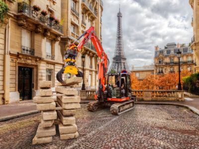 Eiffel Tower seen from the street in Paris, France.  Cobblestone pavement